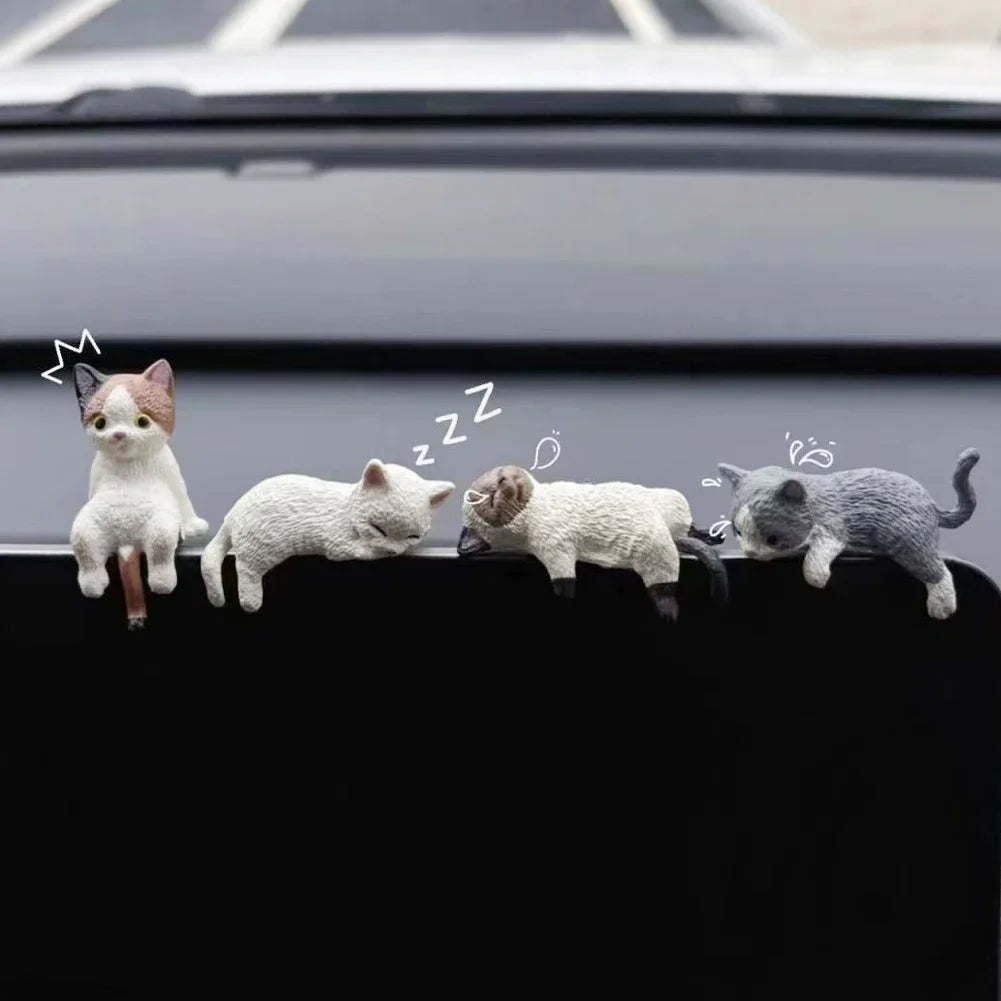 Sleeping cat ornament by nav screen